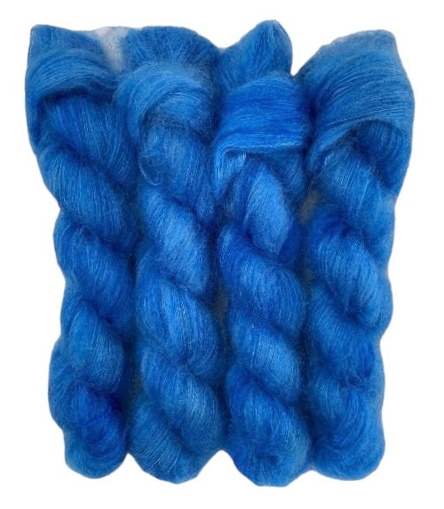 Four blue hand dyed skeins of lace weight mohair and silk yarn on a white background.