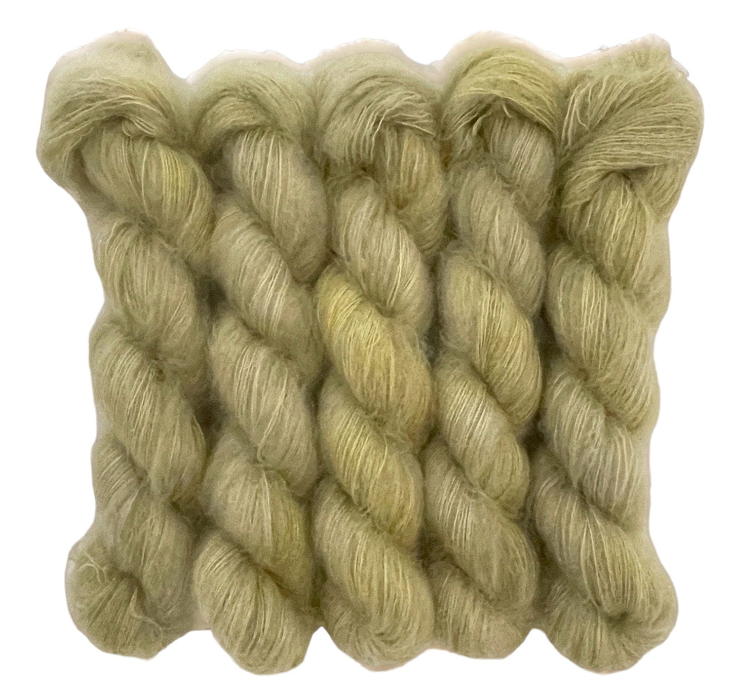 Five olive beige hand dyed skeins of lace weight mohair and silk yarn on a white background.