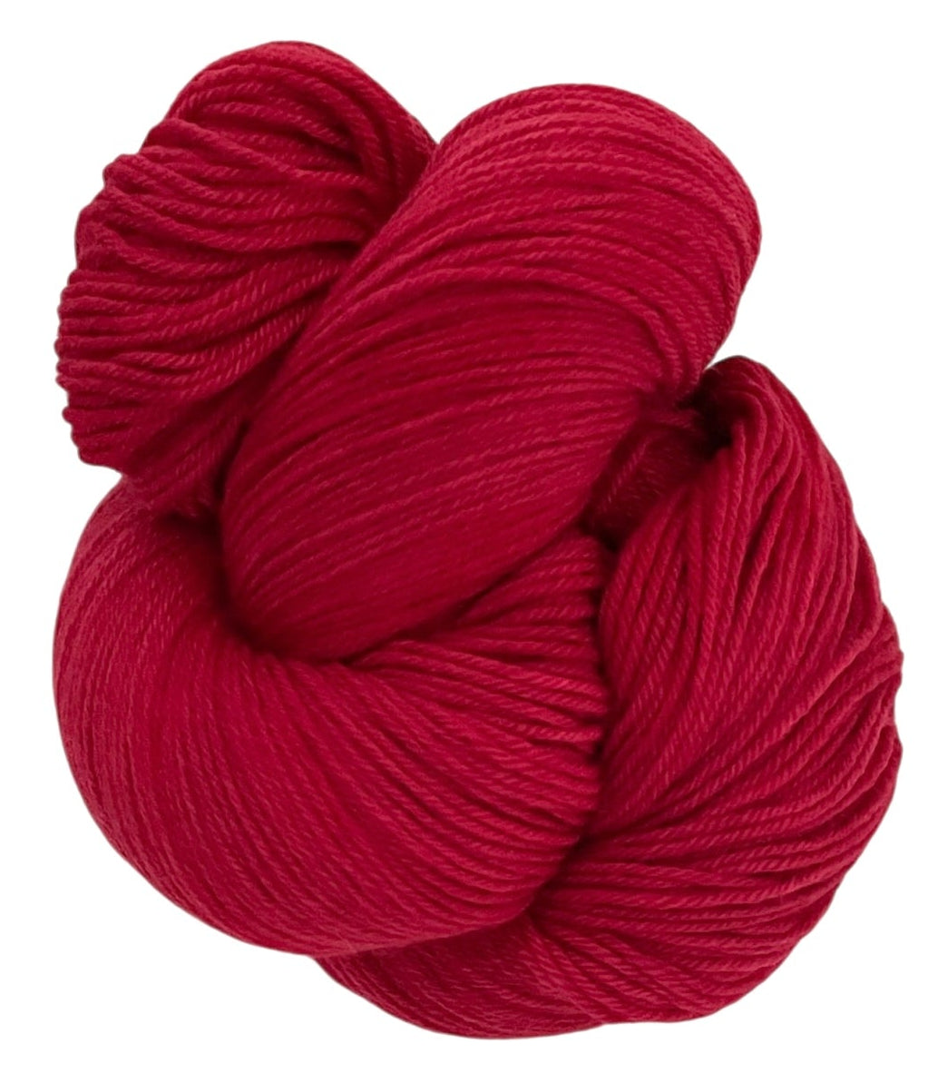 Skein of non superwash fingering weight sustainable merino wool, hand dyed red.