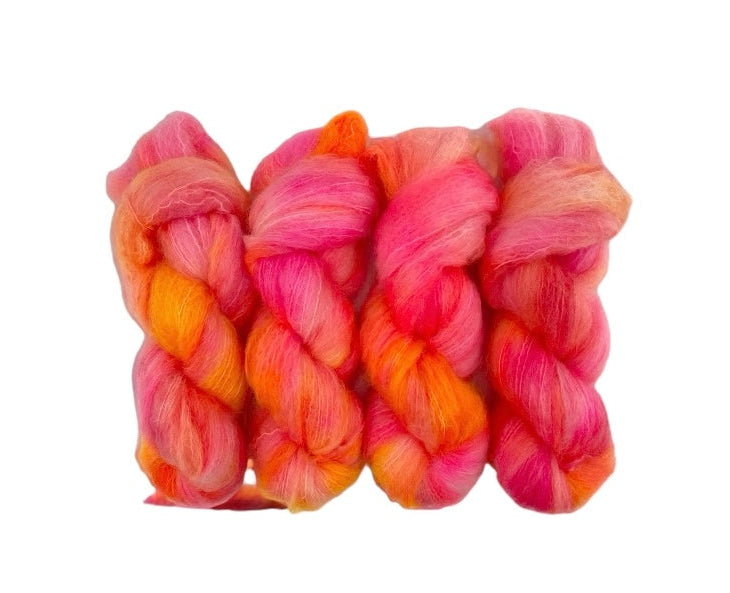 Elevate your knitting with our BRIGHT SUNSHINE Big Mohair yarn! Made with a luxurious blend of mohair, merino wool, and nylon, this hand-dyed yarn features vibrant shades of bright pink and orange. Perfect for double knit projects, each 100g skein adds a touch of warmth and texture to your creations.