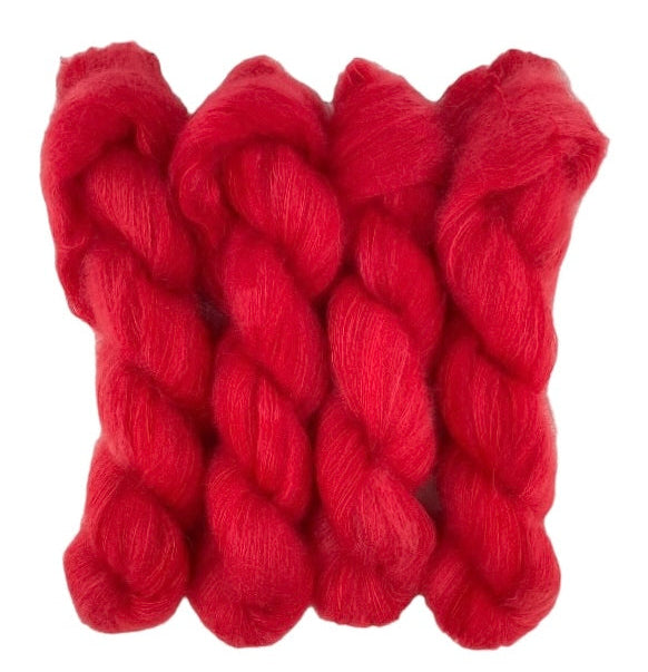 Four bright red hand dyed skeins of lace weight mohair and silk yarn on a white background.