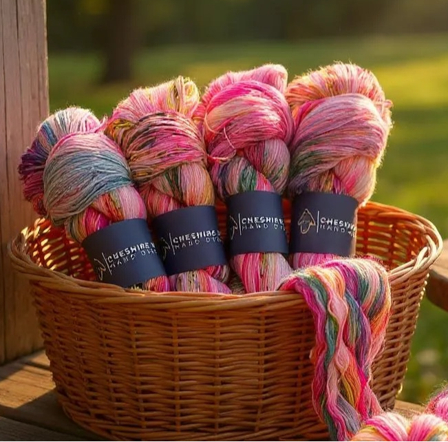 Basket of sock weight superwash merino wool, hand dyed in shades of pink, lemon and lime.