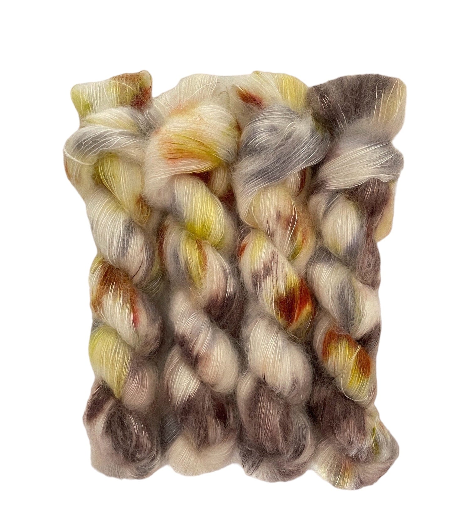 Experience the luxurious blend of kid mohair and silk with GLOW hand dyed yarn. The cream base is intricately dyed with rich brown, rust, and yellow tones, creating a unique and stunning color combination. Perfect for delicate and lightweight lace projects.