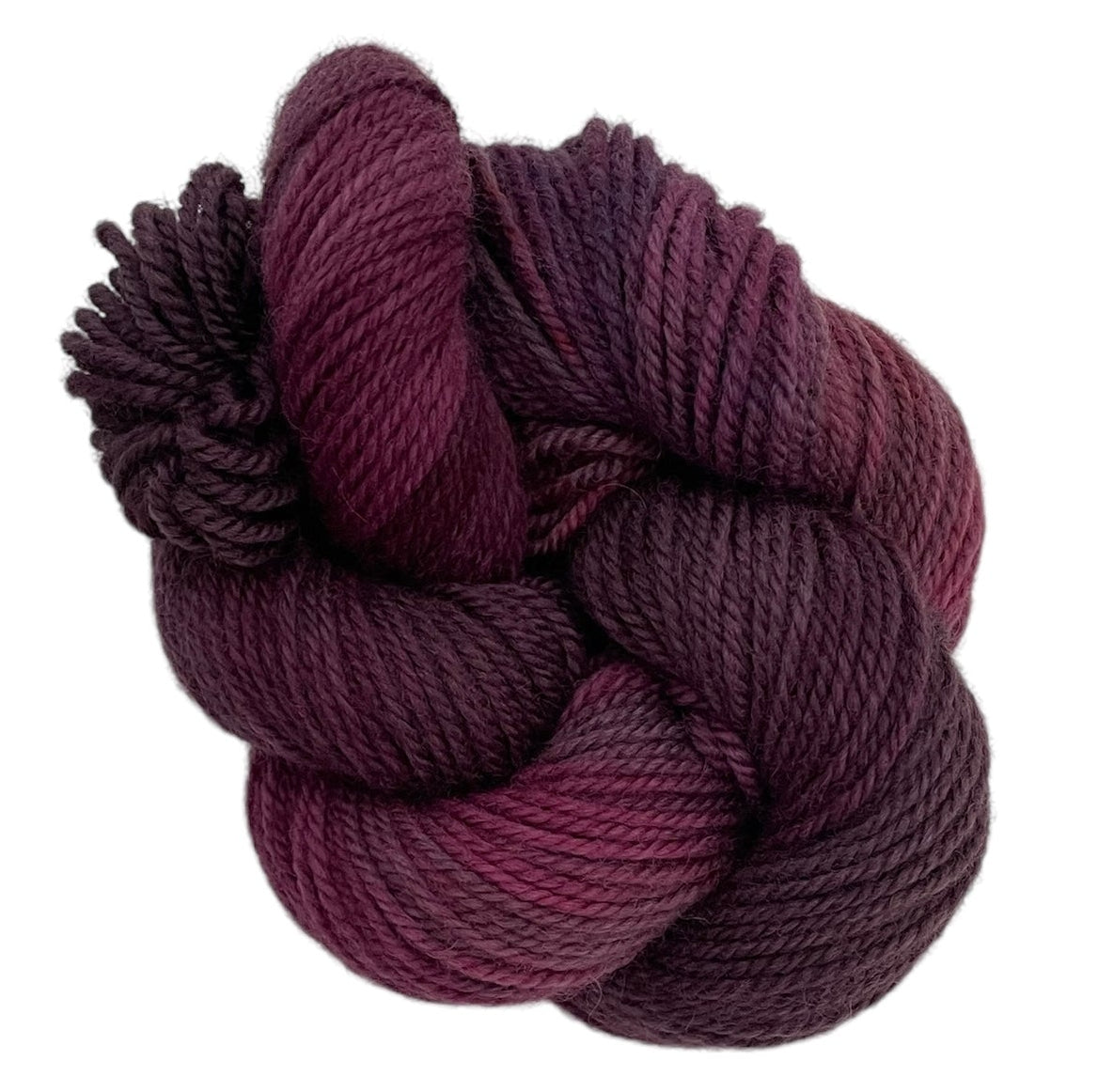 Red and brown hand dyed 50g skein of non superwash DK merino and blue faced leicester on a white background.