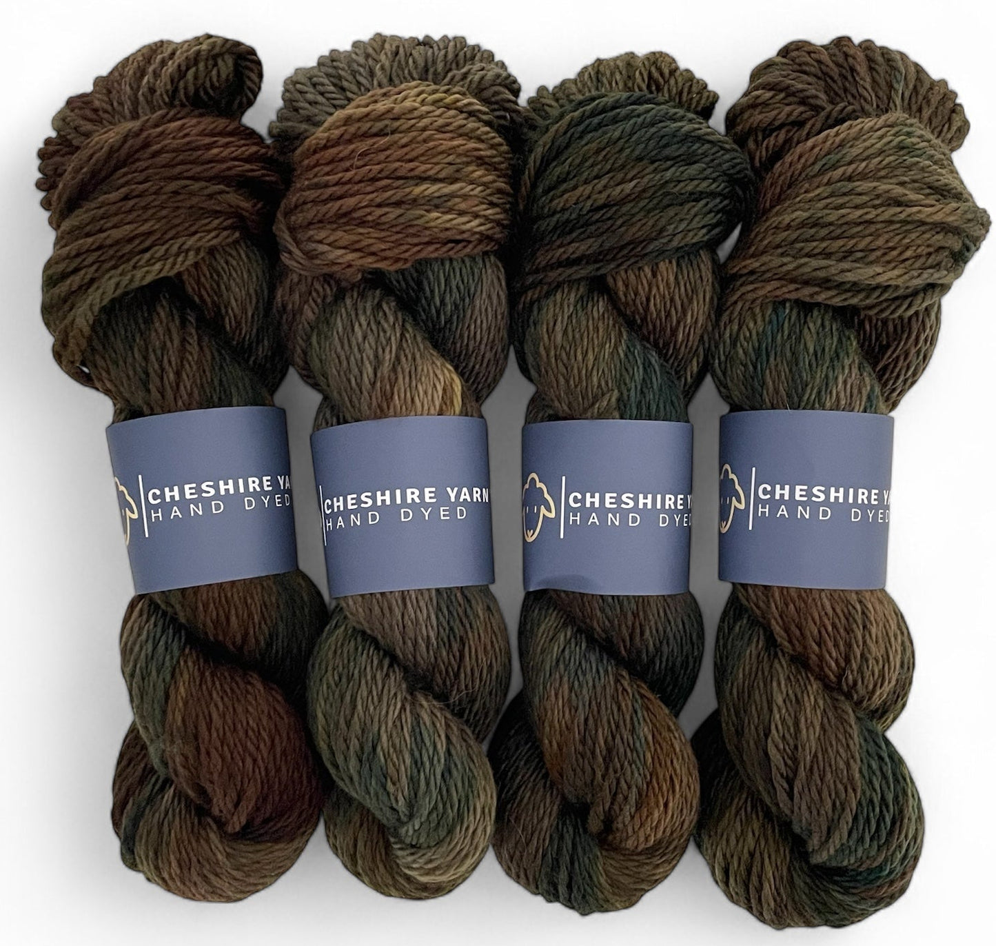 Four skeins of non superwash chunky weight merino wool, hand dyed in earthy brown, green and black.