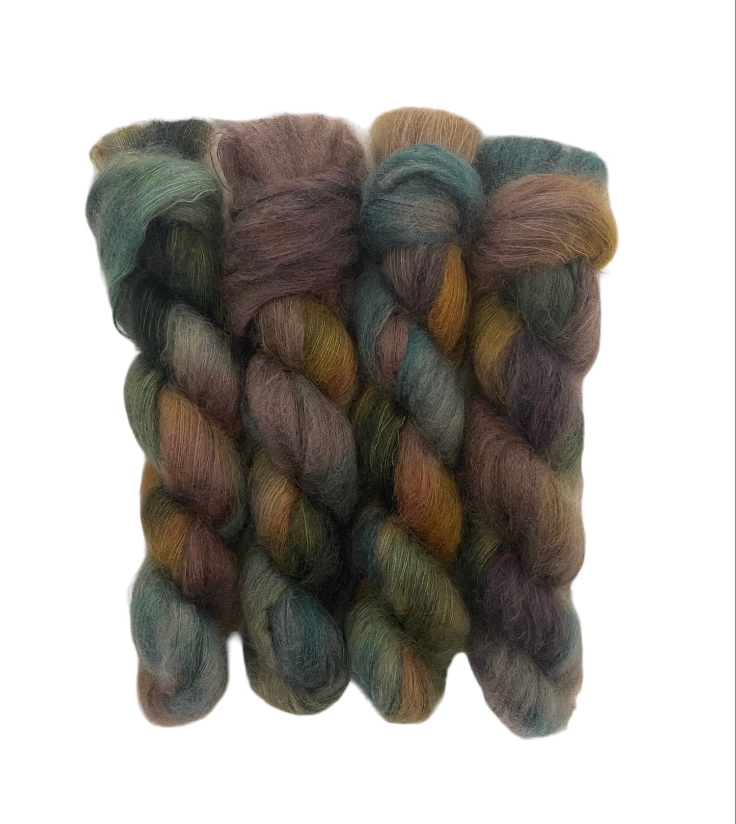 "Expertly hand-dyed with 72% Kid Mohair and 28% Silk, MOUNTAIN MEADOW is a luxurious lace weight yarn that boasts a softness and sheen that will elevate any project. The unique blend of fibers results in rich, mixed colors of brown, green, and gold. Each 50g skein is a perfect choice for a high-quality finish."
