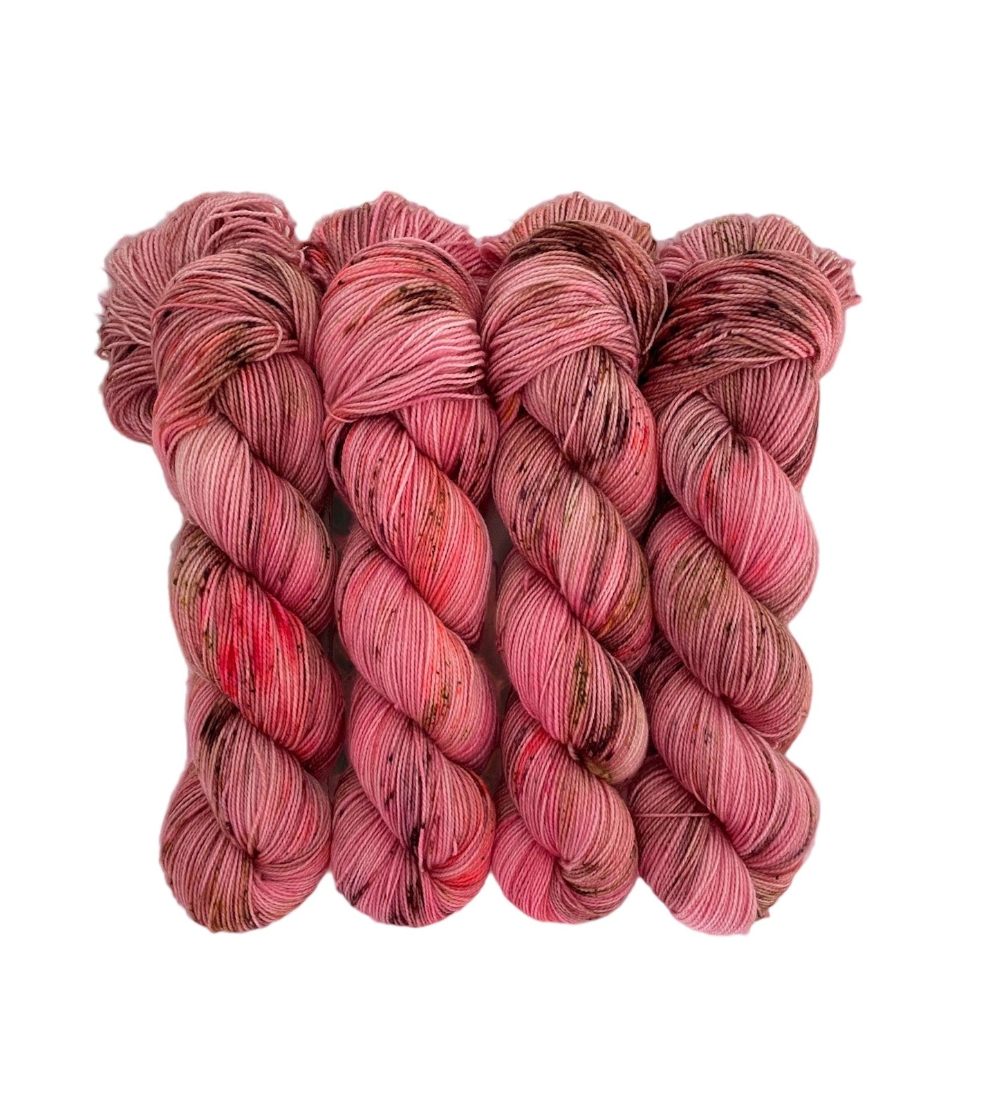 Expertly hand-dyed yarn, in shades of pink, coral, green, and brown speckles. Create unique and vibrant projects with this high-quality yarn. Perfect for knitting, crocheting, and crafting.