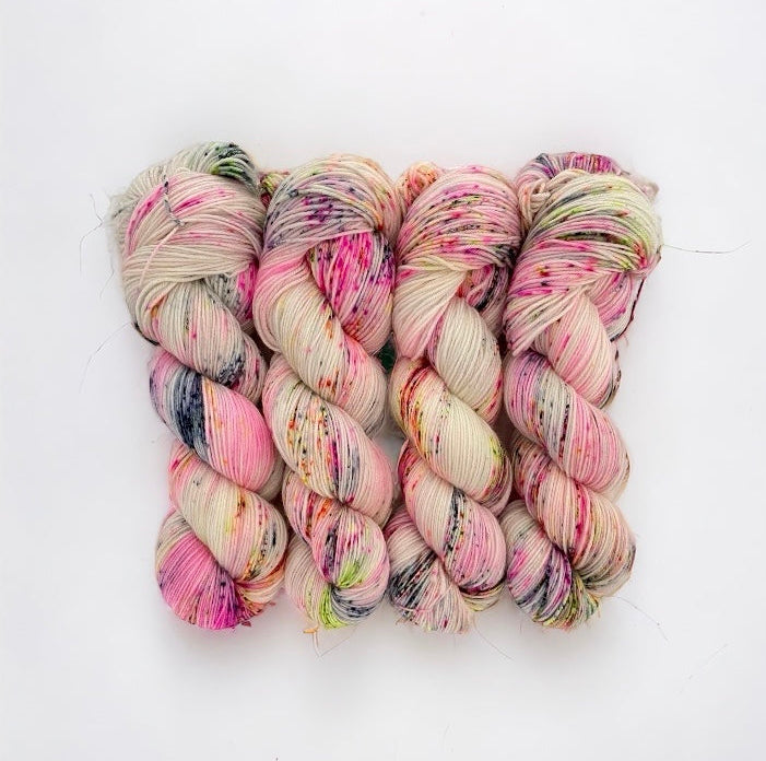 Add a unique touch to your knitting projects with DAZZLE ME Hand Dyed Yarn. Made from 100% superwash merino wool, this speckled yarn adds a playful element to your designs. With a fingering/sock weight and 100g skein, create stunning pieces with ease.