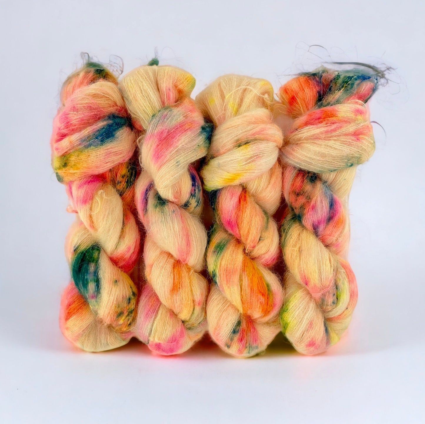 Tropical Smoothie Hand Dyed Yarn. 65% Baby Suri Alpaca. 35% Mulberry Silk. Lace Weight.The vibrant yellow with orange, pink, green and blue hues add a touch of tropical paradise to any project.