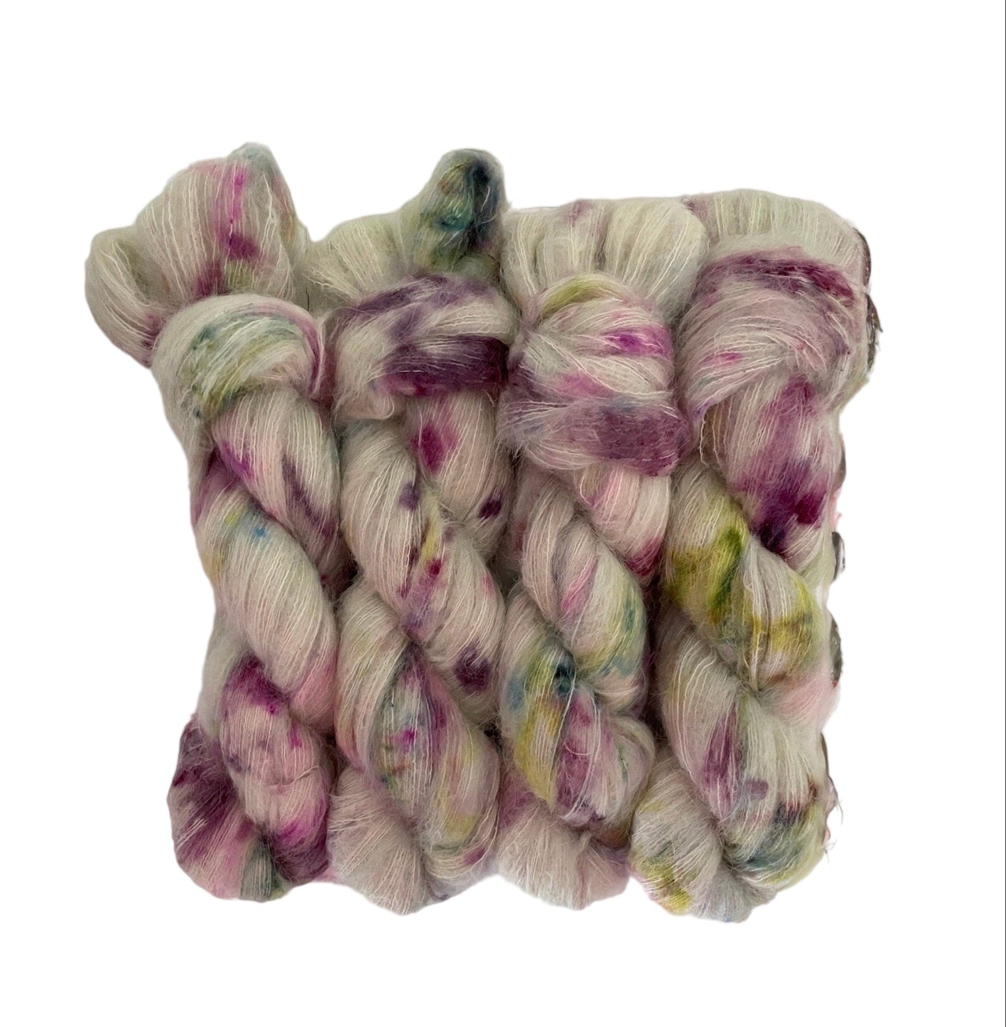 Experience the luxurious softness of our COTTAGE CHARM lace weight yarn, made with Suri Alpaca and Mulberry Silk. Hand-dyed in a beautiful sage green with pops of violet and green, creating a unique and elegant colorway. Enjoy the benefits of this premium blend for your next knitting or crochet project.
