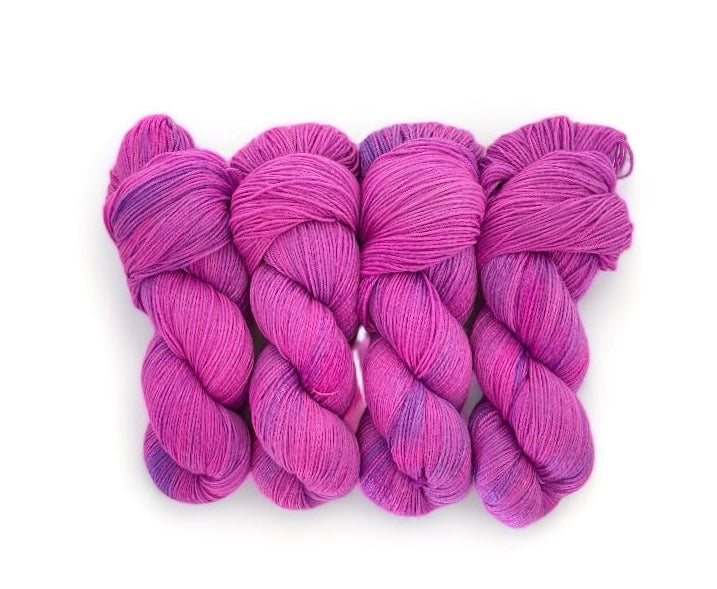 Made from 100% sustainable Merino wool, this fingering knit weight yarn is perfect for eco-conscious knitters looking for high-quality, unique yarn. Each 100g skein is carefully hand-dyed in pinks & purples for a one-of-a-kind result.