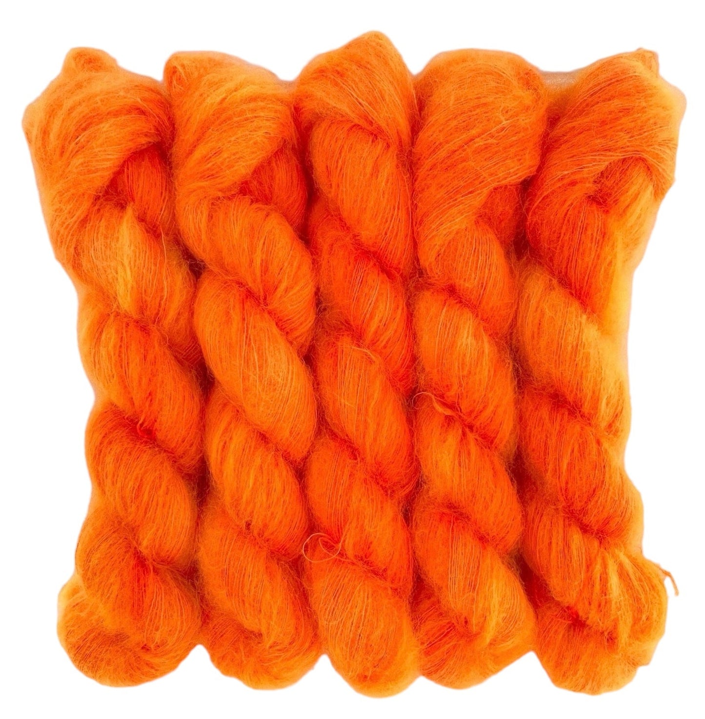 Five orange hand dyed skeins of lace weight mohair and silk yarn on a white background.