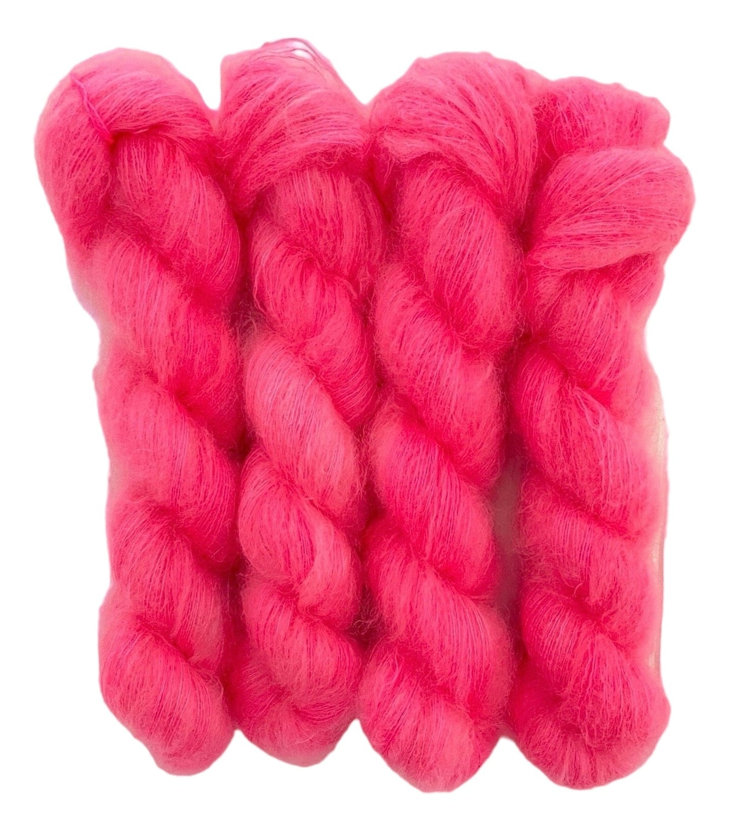 Four pink hand dyed skeins of lace weight mohair and silk yarn on a white background.