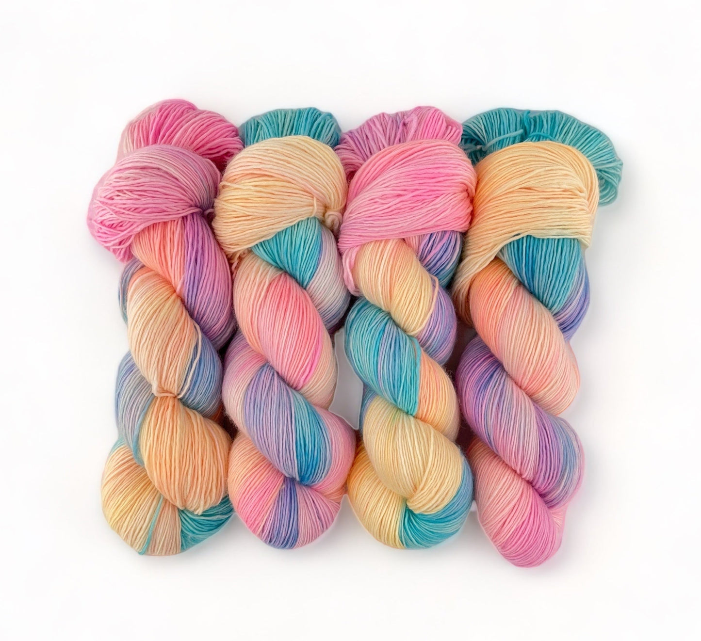Hand Dyed Yarn! Made from 100% Extrafine Superwash Merino wool, this fingering/sock weight singles yarn boasts vibrant candy-colored hues. The result? Soft, durable, and one-of-a-kind creations that will make a statement. Indulge in the best of both worlds: luxury and fun.