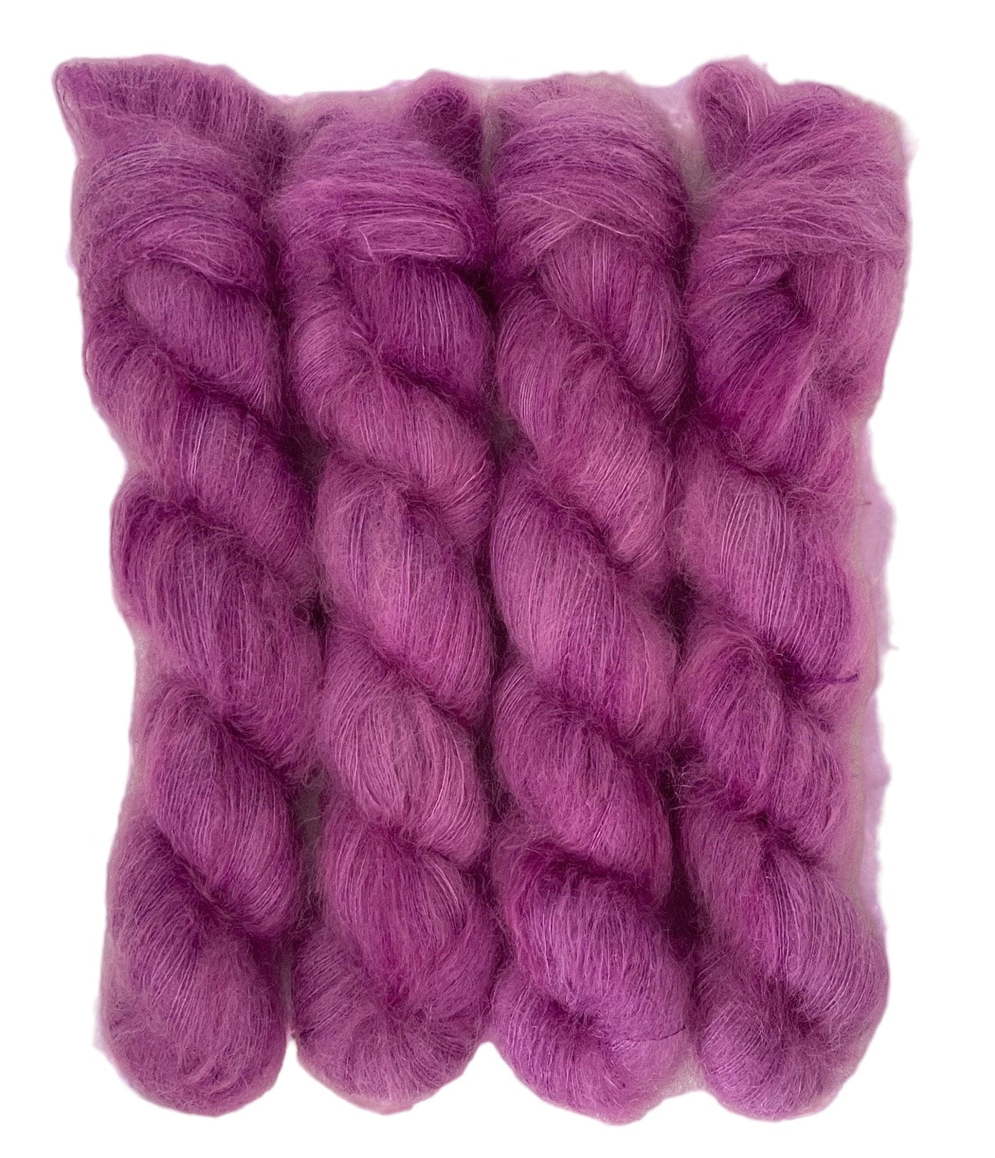 Four purple hand dyed skeins of lace weight mohair and silk yarn on a white background.