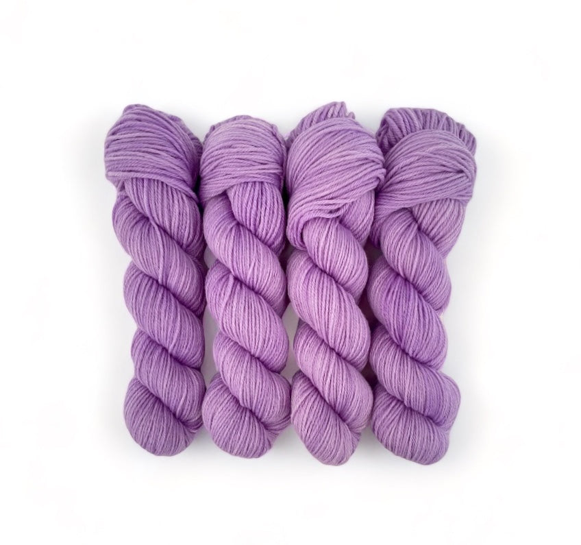 Made from 100% organic merino wool, our hand-dyed base of purple offers a luxurious and eco-friendly choice for your wardrobe.