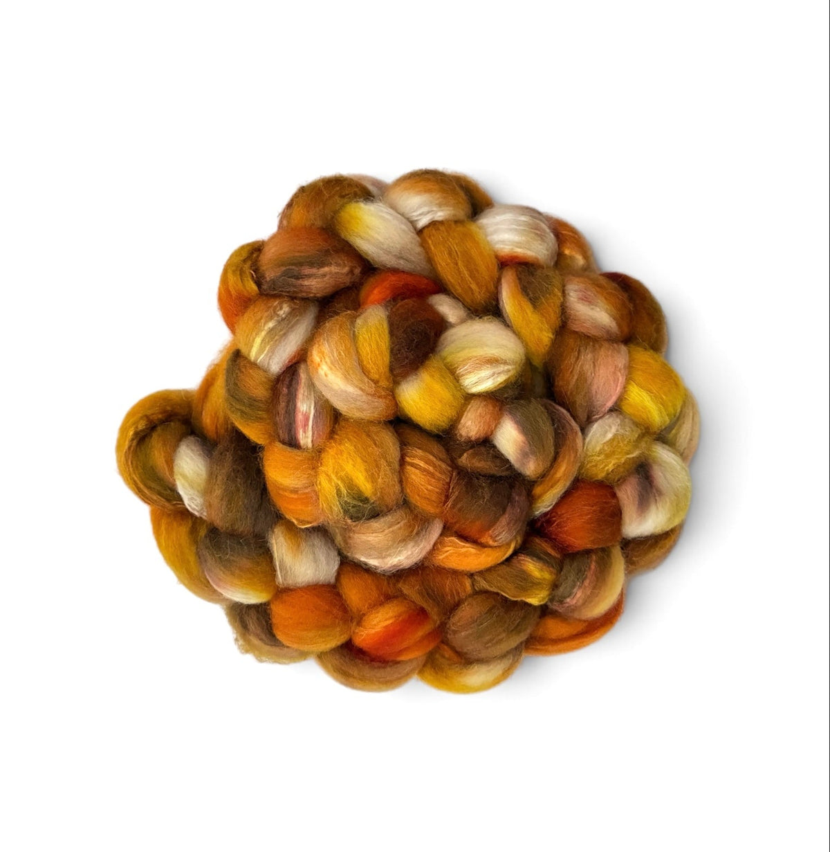 A small pile of variegated mohair wool roving with blended shades of orange, yellow, brown, and cream, photographed from directly above on a white background.
