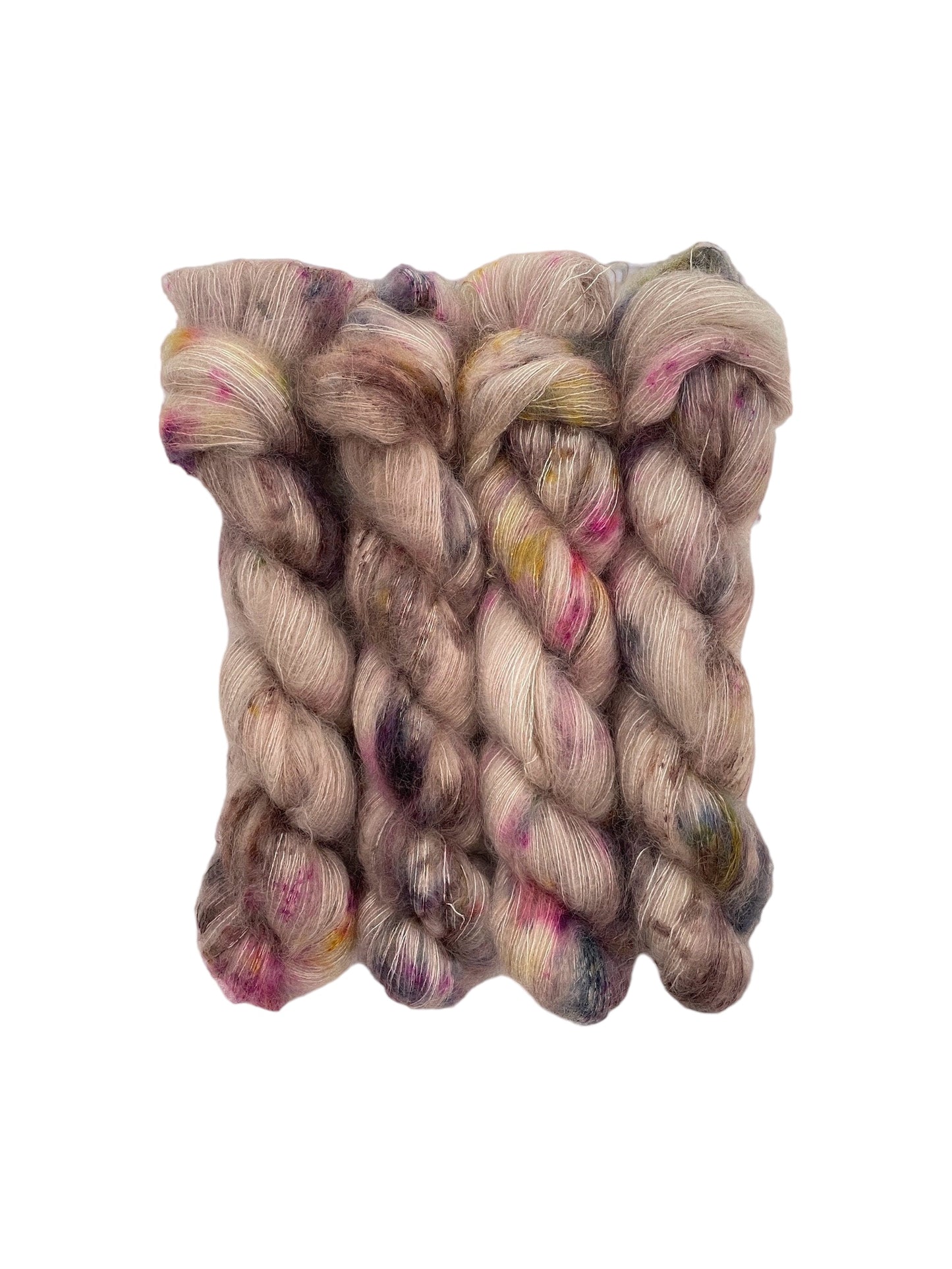 Expertly hand dyed in a delicate blend of kid mohair and silk, BEIGE DAZE brings a touch of luxury to your projects. This lace weight yarn showcases a beautiful beige color with subtle speckles of dark blue and pink, adding a unique and sophisticated touch to any creation.