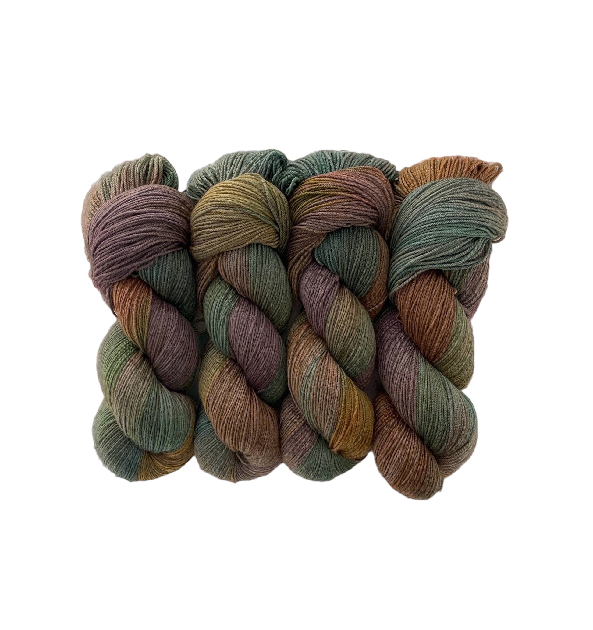 The MOUNTAIN MEADOW Hand Dyed Yarn is made from 100% sustainable Merino wool and is available in a 100g skein. This fingering/sock weight yarn features a unique blend of beige, brown, green, and gold tones, making it a versatile and eco-friendly choice for all your knitting and crochet projects.