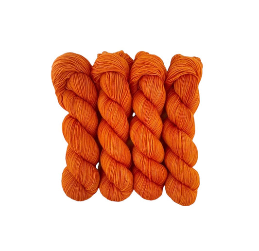 Expertly hand-dyed using premium British Blue Faced Leicester wool and nylon blend, CARROT yarn boasts a vibrant orange  design. This fingering/sock weight yarn is perfect for crafting durable and stylish accessories with a soft touch.