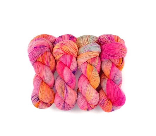 The HAPPY ENDINGS Hand Dyed Yarn is made from 100% sustainable Merino wool and is available in a 100g skein. This fingering/sock weight yarn features a unique blend of pink, orange, pale blue & lilac tones, making it a versatile and eco-friendly choice for all your knitting and crochet projects.