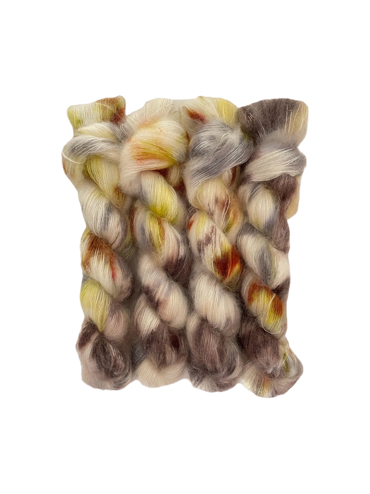 Experience the luxurious blend of kid mohair and silk with GLOW hand dyed yarn. The cream base is intricately dyed with rich brown, rust, and yellow tones, creating a unique and stunning color combination. Perfect for delicate and lightweight lace projects.