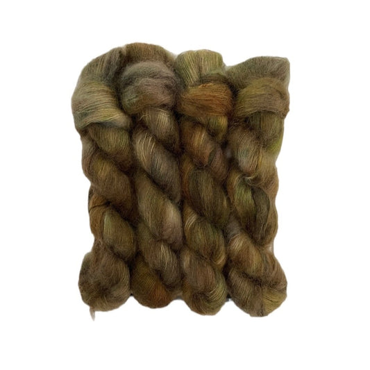 CAMO hand-dyed yarn is a blend of kid mohair and silk, creating a soft and lightweight texture. The beautiful colour of green & brown will add a unique touch to your knitting projects. Each 50g skein is carefully crafted for a truly one-of-a-kind piece.