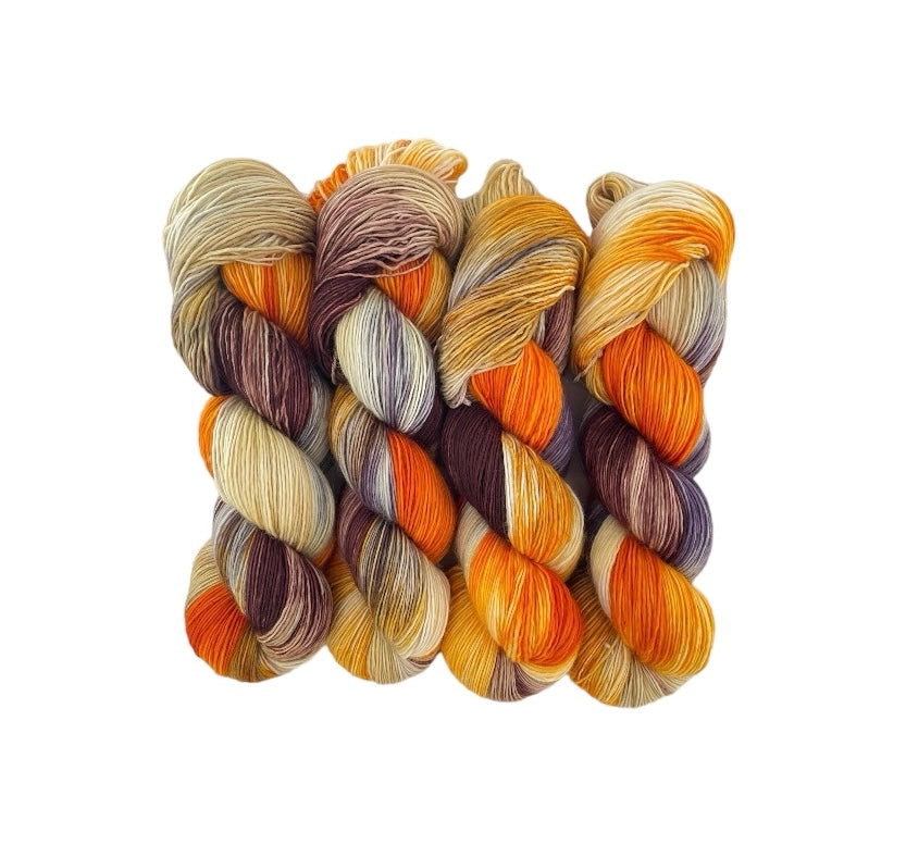 Experience the warmth and beauty of autumn with our AUTUMN SPICE hand dyed yarn. Made with 100% extrafine superwash merino wool in a single ply design, this fingering/sock weight yarn is perfect for creating unique and luxurious knitted or crocheted items. With its rich and vibrant autumn colors, this 100g skein is sure to add a touch of natural beauty to your crafting projects.