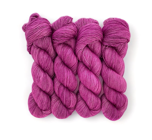 A very soft and lustrous single ply yarn with a loose twist, resulting in a velvety texture with slight variations in thickness. It is perfect for shawls and cowls where the silk content gives the items sheen and drape.  The silk reflects the light to give a lustrous finish.