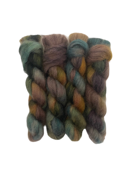 "Expertly hand-dyed with 72% Kid Mohair and 28% Silk, MOUNTAIN MEADOW is a luxurious lace weight yarn that boasts a softness and sheen that will elevate any project. The unique blend of fibers results in rich, mixed colors of brown, green, and gold. Each 50g skein is a perfect choice for a high-quality finish."