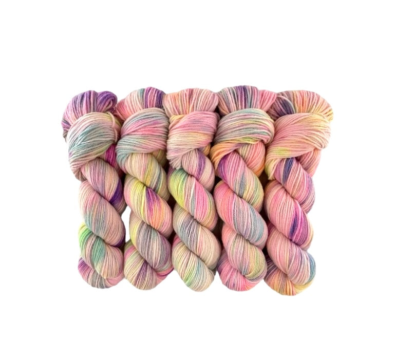 Made from 100% organic merino wool, our hand-dyed base of  pastel rainbow colours offers a luxurious and eco-friendly choice for your wardrobe. 