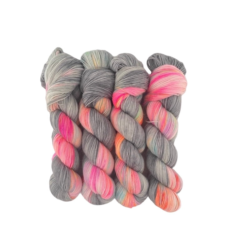 PIZZAZZ offers a vibrant and unique color combination of hand-dyed yarn in grey, pinks, and oranges. Crafted with high-quality materials, this yarn is ideal for creating one-of-a-kind projects with an unexpected pop of color. Add a touch of personality to your next knitting or crochet project with PIZZAZZ.