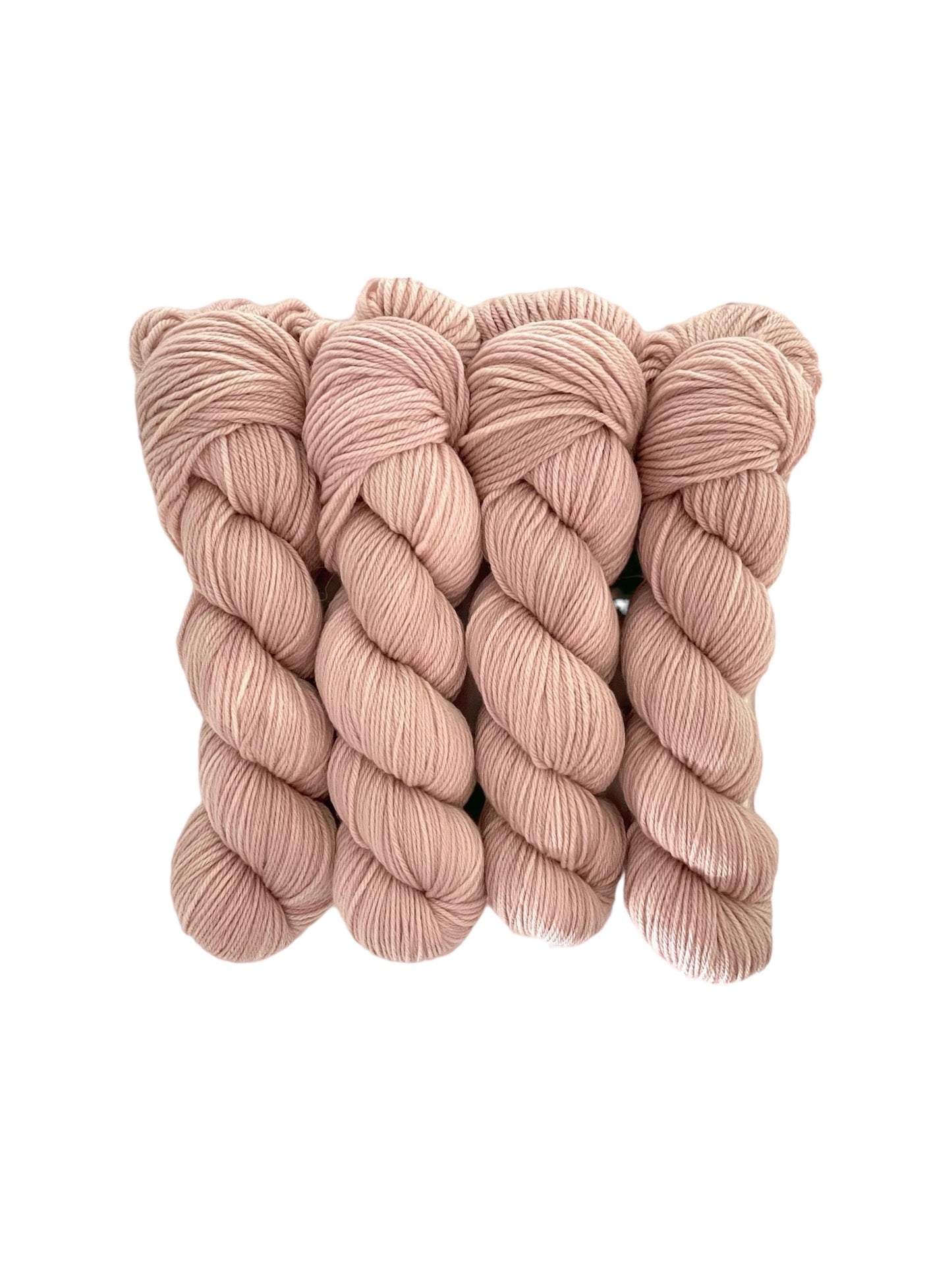 Made from 100% organic merino wool, our hand-dyed base of dusty pink offers a luxurious and eco-friendly choice for your wardrobe. 