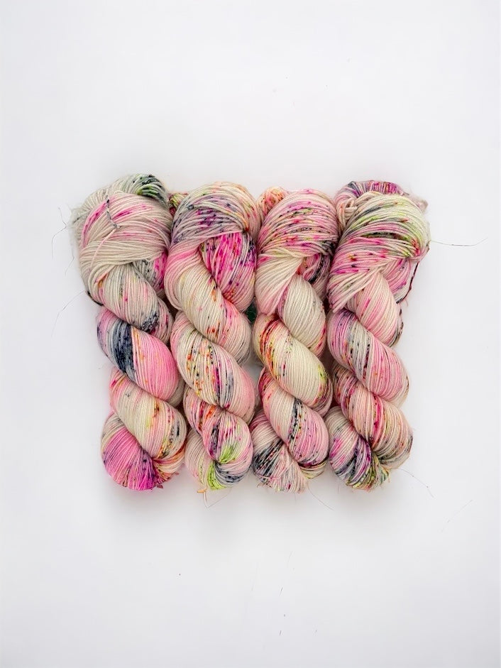 Add a unique touch to your knitting projects with DAZZLE ME Hand Dyed Yarn. Made from 100% superwash merino wool, this speckled yarn adds a playful element to your designs. With a fingering/sock weight and 100g skein, create stunning pieces with ease.