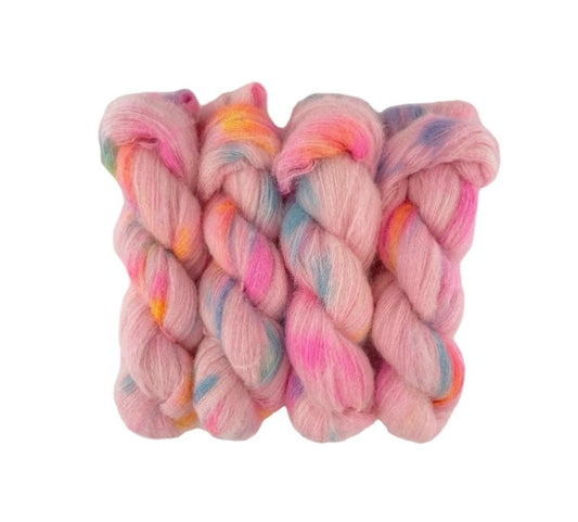 Indulge in luxury with our SO SWEET yarn. This lace weight blend of baby suri alpaca and mulberry silk is hand-dyed in a delicate pale pink hue with a dash of blue and orange. Experience the softness and shine of this exquisite yarn, perfect for delicate and statement pieces.
