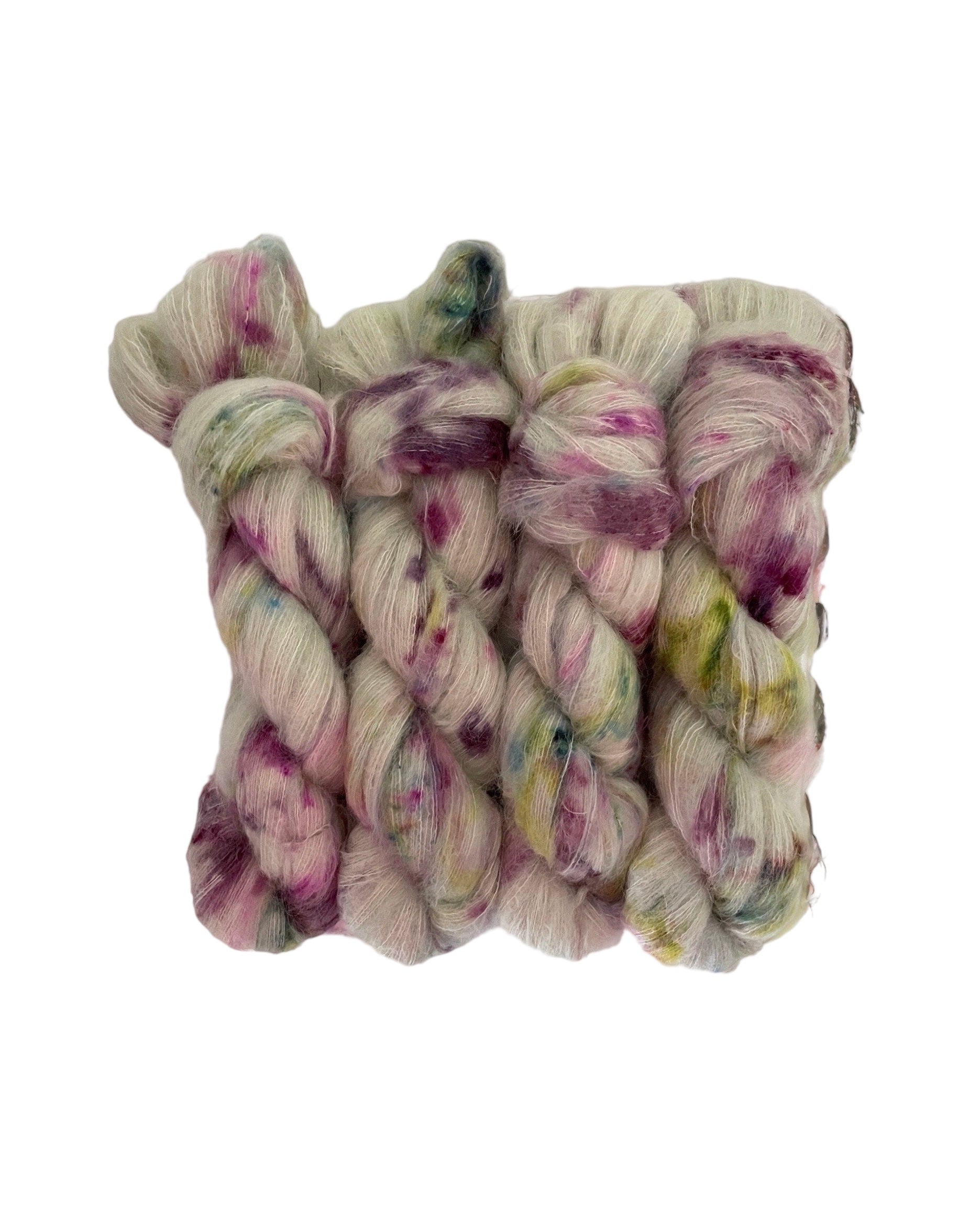 Experience the luxurious softness of our COTTAGE CHARM lace weight yarn, made with Suri Alpaca and Mulberry Silk. Hand-dyed in a beautiful sage green with pops of violet and green, creating a unique and elegant colorway. Enjoy the benefits of this premium blend for your next knitting or crochet project.