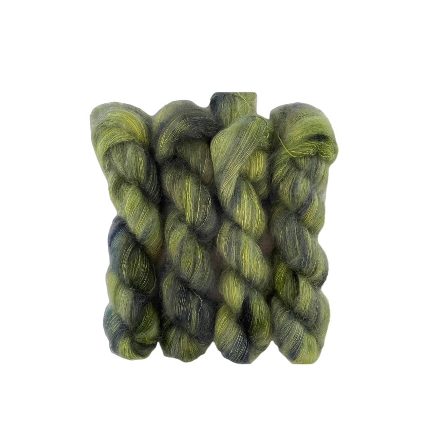 BEANSTALK is a unique fabric made from hand-dyed mohair and silk. The blend of green and dark green creates a one-of-a-kind color that is sure to stand out. Experience the luxurious feel of mohair and silk while adding a touch of greenery to your wardrobe.