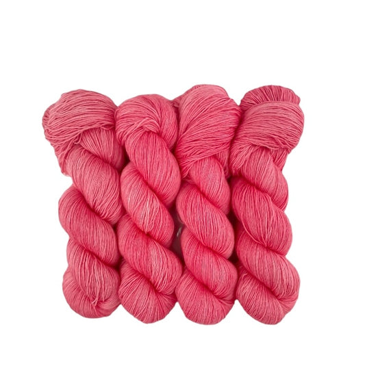 A very soft and lustrous single ply yarn with a loose twist, resulting in a velvety texture with slight variations in thickness. It is perfect for shawls and cowls where the silk content gives the items sheen and drape. The silk reflects the light to give a lustrous finish.