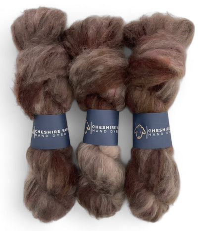 Three skeins of DK weight mohair yarn, hand dyed in shades of brown.