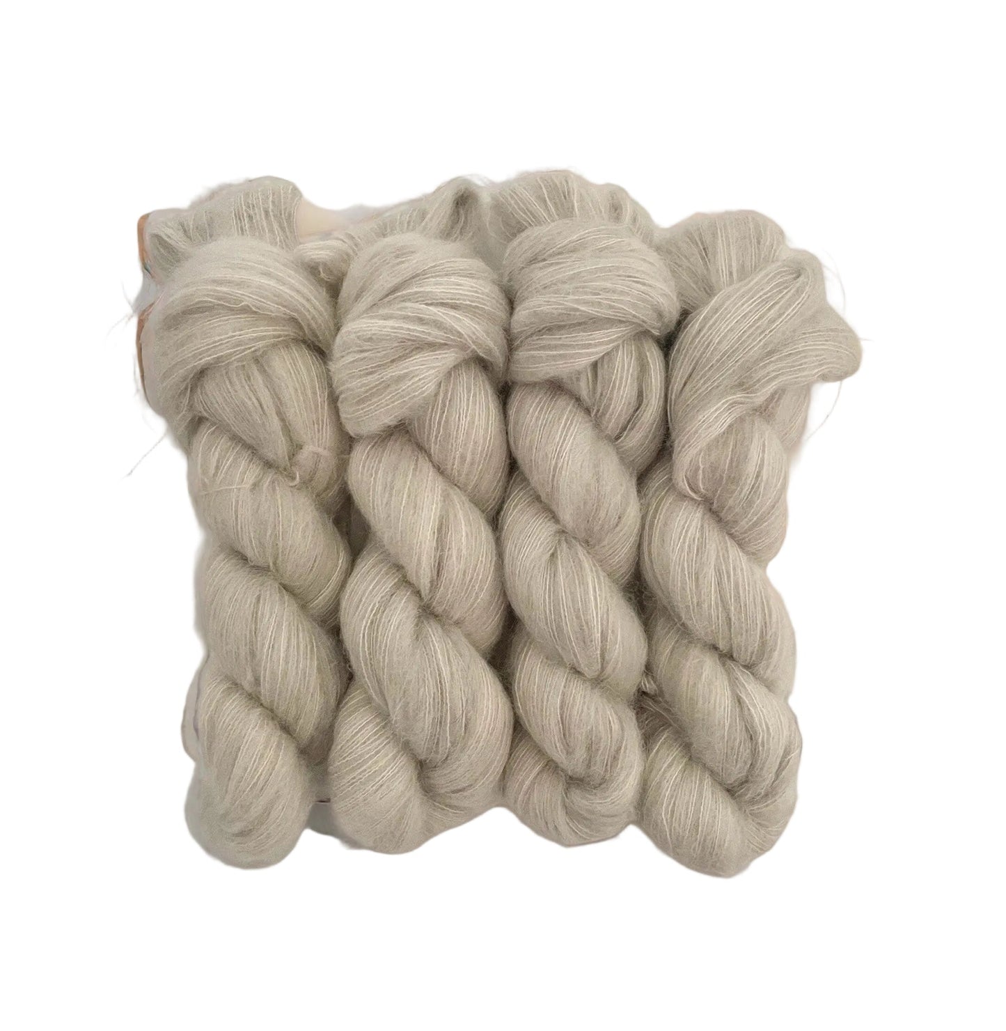 Ghost hand dyed yarn. Beautifully soft and light as air, this luxurious blend of Suri Alpaca and silk is a delight to wear against the skin. Can be used on its own (held single or double) or in combination with other yarns to add fluffy texture to your projects. A perfect substitute for those sensitive to mohair.