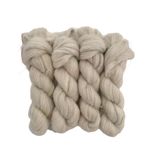 Ghost hand dyed yarn. Beautifully soft and light as air, this luxurious blend of Suri Alpaca and silk is a delight to wear against the skin. Can be used on its own (held single or double) or in combination with other yarns to add fluffy texture to your projects. A perfect substitute for those sensitive to mohair.