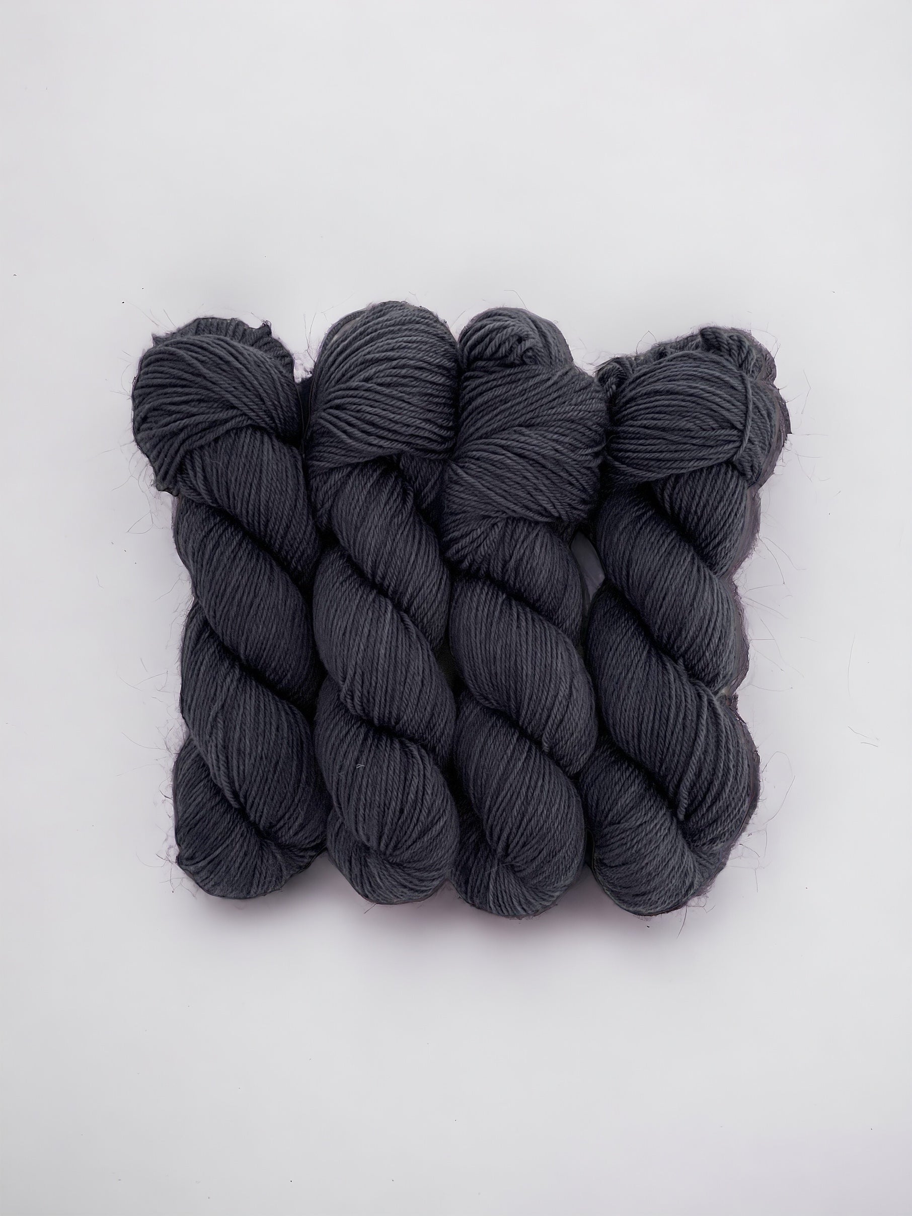 Made from 100% superwash BFL wool, this double knit weight yarn boasts a rich, dark blue hue. Soft and durable, it's perfect for crafting cozy blankets, hats, and more. Elevate your projects with the quality of bluefaced leicester wool.