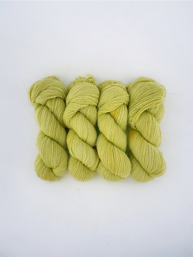 Introducing our hand-dyed Little Lime yarn! Made from 100% sustainable Merino wool, this fingering/sock weight yarn. Perfect for eco-conscious knitters looking for high-quality, unique yarn. Each 100g skein is carefully hand-dyed for a one-of-a-kind result.