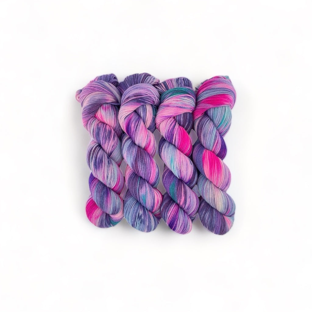 Hand dyed 100% non superwash merino in pinks, lilacs & blues.A high twist yarn is a fantastic choice for not only socks but also light knit and crochet projects.