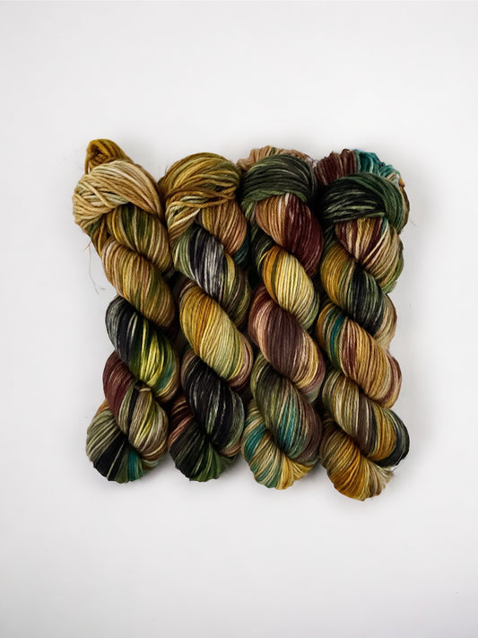 HIDDEN FOREST hand dyed yarn is made from 100% superwash merino wool. The double knit yarn is perfect for a variety of projects, making it a versatile and essential tool for any knitting or crocheting enthusiast. Each 100g skein provides premium quality and vibrant color for all your creative needs.