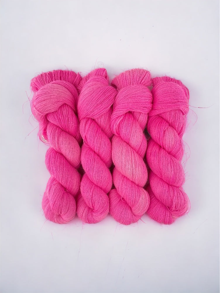 Crafted by hand and dyed in a vibrant pink hue, our BUBBLEGUM yarn boasts luxurious 100% baby alpaca fibers. Perfect for lace projects, the semi-solid color adds depth and dimension to your creations. Each 100g skein is a stunning must-have for any knitting or crochet enthusiast.