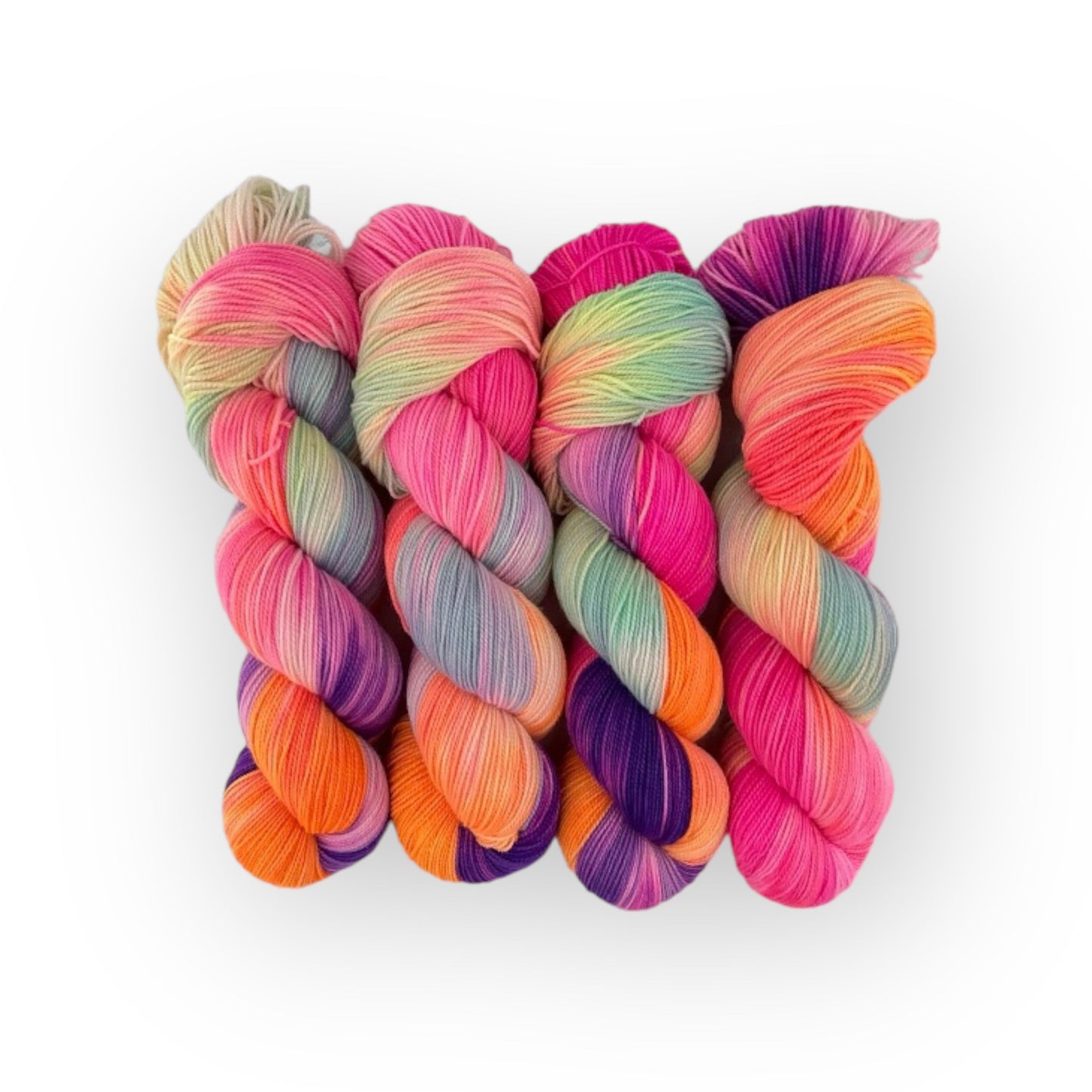 Introducing RAINBOW BUNCH, the perfect hand dyed yarn for all your knitting needs! Made from a blend of super soft and durable fingering weight merino and nylon, this vibrant yarn is ideal for creating unique socks, shawls, garments, and accessories. With a range of eye-catching colors, you'll love the endless possibilities this yarn offers.