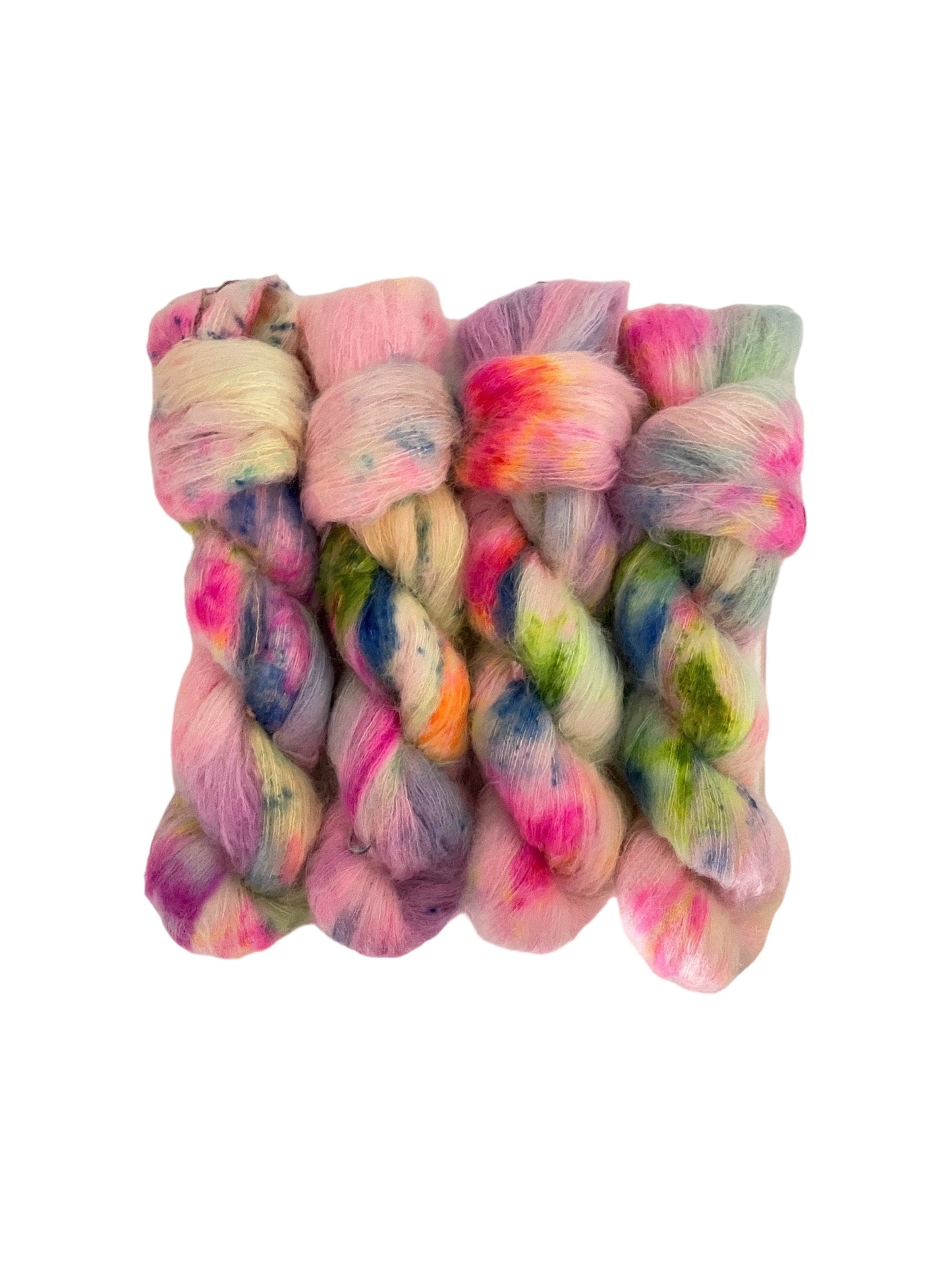 Beautifully soft and light as air, this luxurious blend of Suri Alpaca and silk is a delight to wear against the skin. Can be used on its own (held single or double) or in combination with other yarns to add fluffy texture to your projects. A perfect substitute for those sensitive to mohair. Hand dyed in rainbow colours