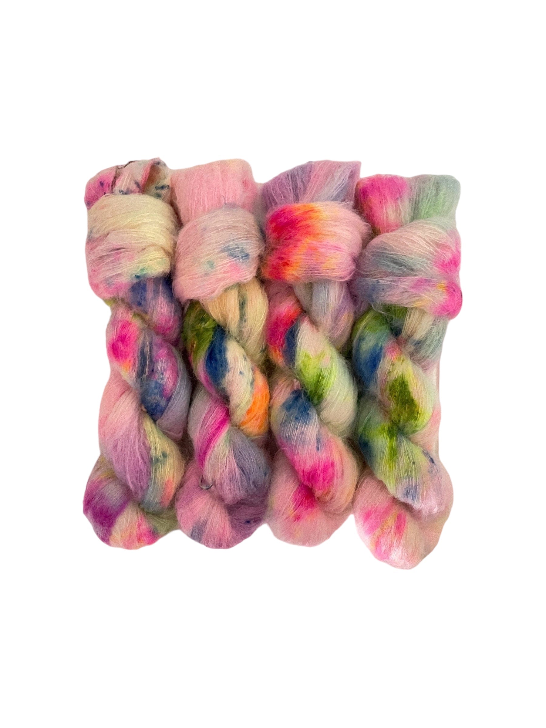 Beautifully soft and light as air, this luxurious blend of Suri Alpaca and silk is a delight to wear against the skin. Can be used on its own (held single or double) or in combination with other yarns to add fluffy texture to your projects. A perfect substitute for those sensitive to mohair. Hand dyed in rainbow colours