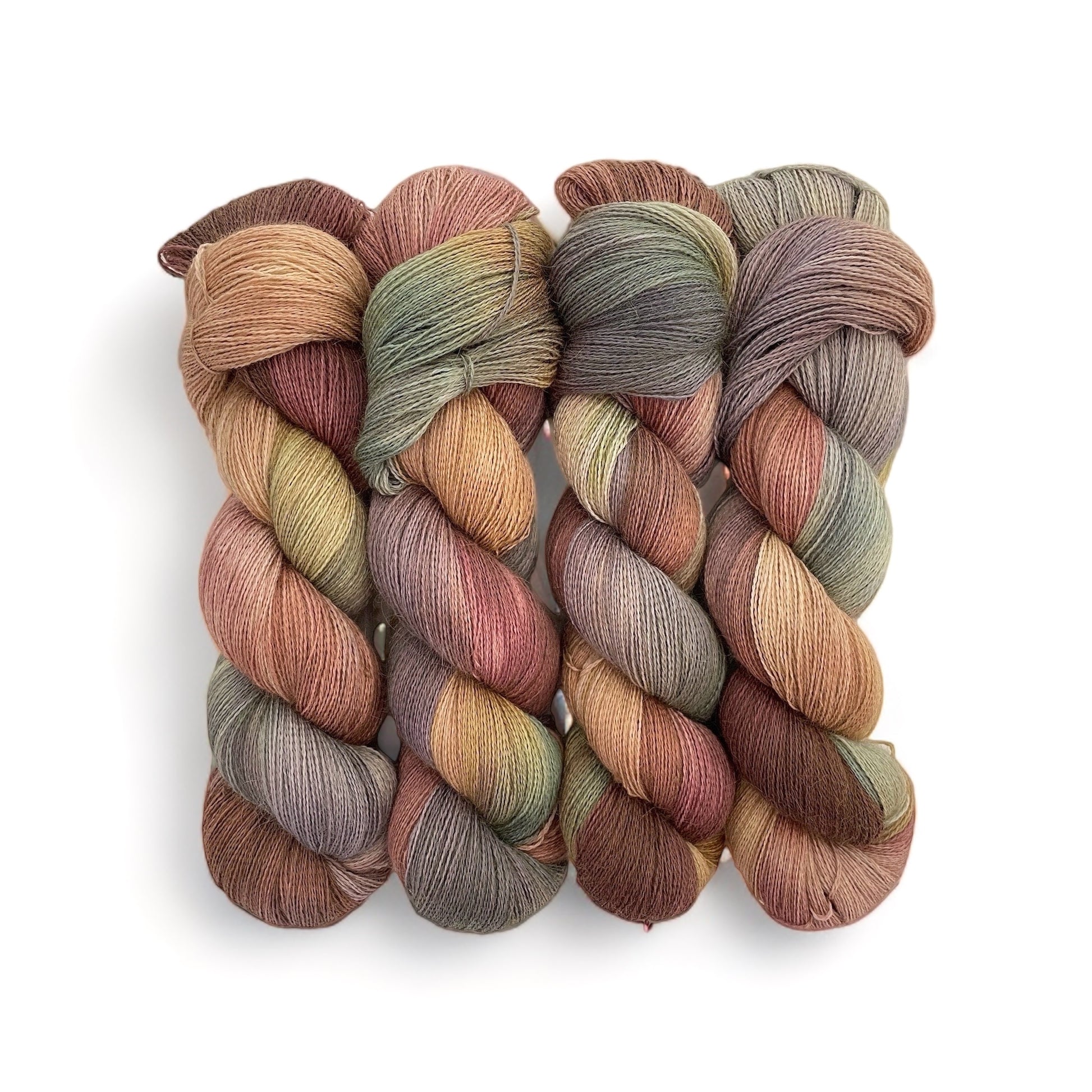 Introducing DUSTY PATH - Hand Dyed Yarn, an exquisite blend of 100% baby alpaca. This lace weight yarn, hand dyed in beautiful shades of brown and green, is perfect for both weaving and knitting projects. Experience the luxurious softness of alpaca fiber in a unique and elegant yarn.